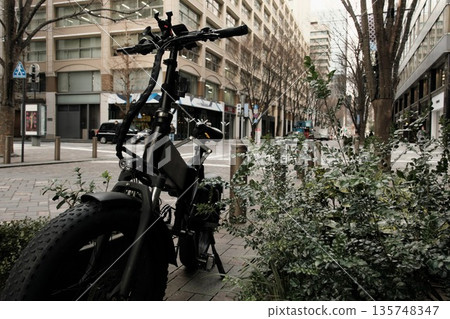 A big bicycle found in a back alley A big bicycle found in a back alley 135748347