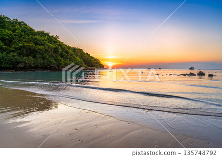 Beautiful collection of Koh Samed island landscapes featuring turquoise waters, speedboats, floating piers, and a golden sunset over a tropical beach 135748792