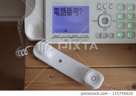 Old and dirty landline phone with fax machine, push button phone 135748829