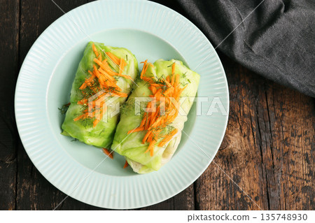 Cabbage rolls stuffed with meat, rice and vegetables on a rustic table Cabbage rolls stuffed with meat, rice and vegetables on a rustic table 135748930