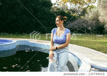 young pretty woman talking on phone at swimming pool, lifestyle people concept 135749410