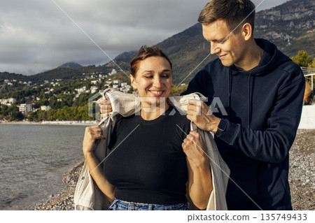 young caucasian couple tourists having fun on sea side, lifestyle people concept 135749433