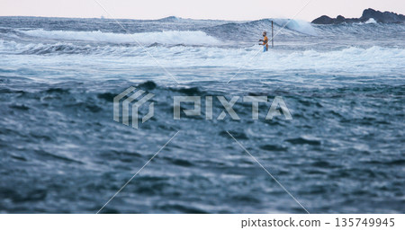 Fisherman in Ocean Waves Unawatuna Sri Lanka 135749945