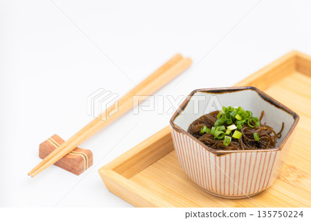Mozuku seaweed on a wooden tray Mozuku seaweed on a wooden tray 135750224