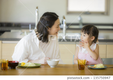 A happy family at the dinner table A happy family at the dinner table 135750947