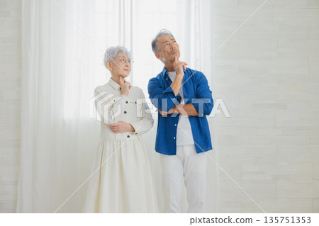 Senior couple thinking Senior couple thinking 135751353