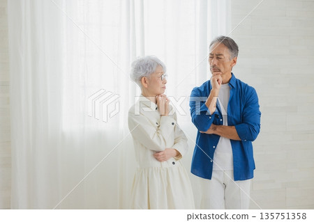 Senior couple thinking Senior couple thinking 135751358