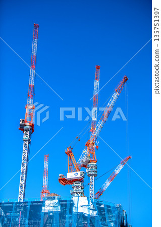 New landscape of Tokyo cityscape in Japan. TOKYO TORCH Huge cranes in Otemachi, in front of Tokyo Station, the gateway to Tokyo 135751397