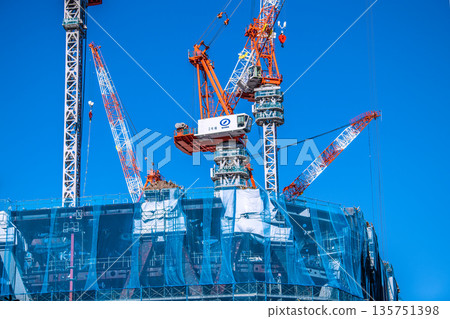 New landscape of Tokyo cityscape in Japan. TOKYO TORCH Huge steel structure and cranes in Otemachi. To the astonishing tower 135751398