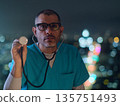 Male doctor holding stethoscope for health checkup 135751493