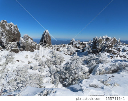 Yatsugatake in the depths of winter (trees and rocks covered in frost seen from the hiking trail leading to Mt. Mitsudake) Yatsugatake in the depths of winter (trees and rocks covered in frost seen from the hiking trail leading to Mt. Mitsudake) 135751641