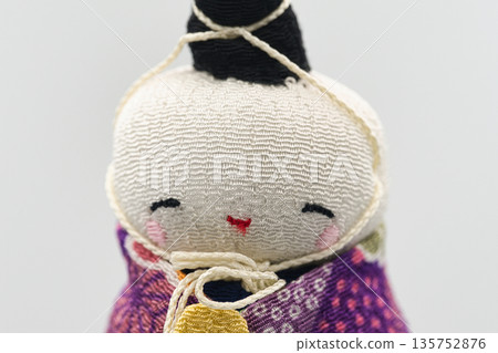 Chirimen crafted Hina dolls. Close-up of a Japanese-style doll reminiscent of Sagemon. 135752876