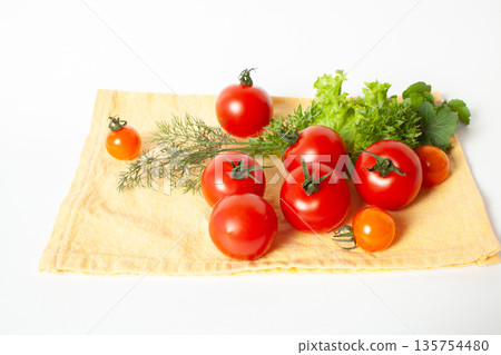 Mini tomatoes and herbs 135754480