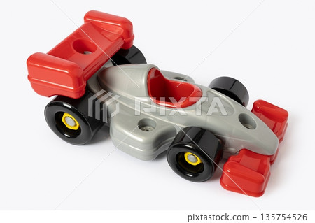 Plastic toy racing car with red and silver colors isolated on white background Plastic toy racing car with red and silver colors isolated on white background 135754526