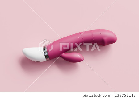 Pink Silicone Vibrator Personal Massager on Pastel Background. 135755113