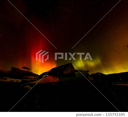 The Aurora Borealis, the northern lights, showing up above bungalow in County Donegal, Ireland The Aurora Borealis, the northern lights, showing up above bungalow in County Donegal, Ireland 135755395