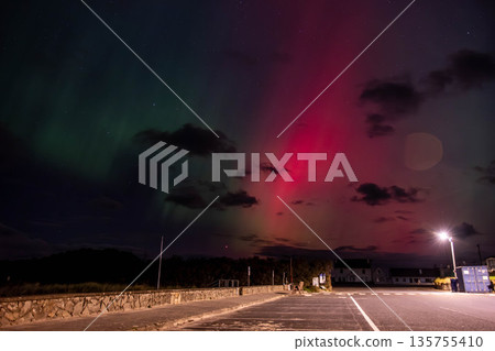 The Aurora Borealis, the northern lights, showing up in Portnoo, County Donegal, Ireland. The Aurora Borealis, the northern lights, showing up in Portnoo, County Donegal, Ireland. 135755410