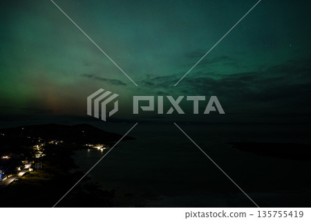 The Aurora Borealis, the northern lights, showing up above Portnoo in County Donegal, Ireland The Aurora Borealis, the northern lights, showing up above Portnoo in County Donegal, Ireland 135755419