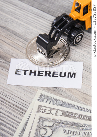 Ethereum, miniature excavator and dollars Ethereum, miniature excavator and dollars 135755857