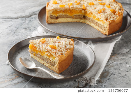 Layered Apricot Nut Spice Cake close-up on a plate. Horizontal 135756077