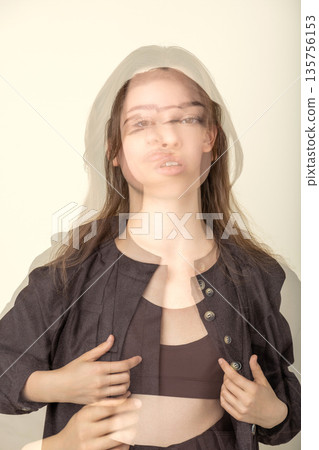 Woman with double exposure showing motion and identity concept 135756153