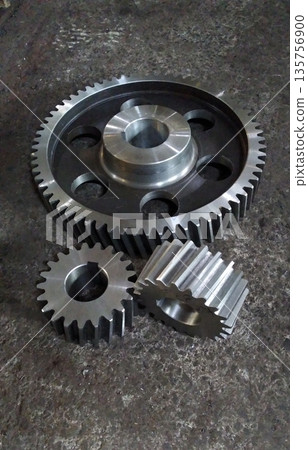 Metal gear wheel engine, mechanic industry concept. Mechanical engineering. Finished products. Metal gear wheel engine, mechanic industry concept. Mechanical engineering. Finished products. 135756900