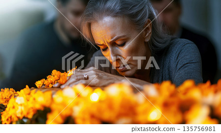 Man and woman mourning together over coffin adorned with pale roses and soft light. Death, funeral and family touching coffin in church Man and woman mourning together over coffin adorned with pale roses and soft light. Death, funeral and family touching coffin in church 135756981