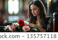 Funeral, sad and woman with flower on coffin after loss of loved one, family or friend. A young woman in church surrounded 135757118