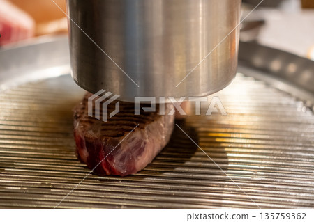 Beef on the grill. BBQ rare meat with soft focus 135759362