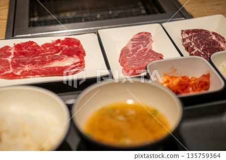Korean Style Barbecue on plate. BBQ rare meat with soft focus 135759364