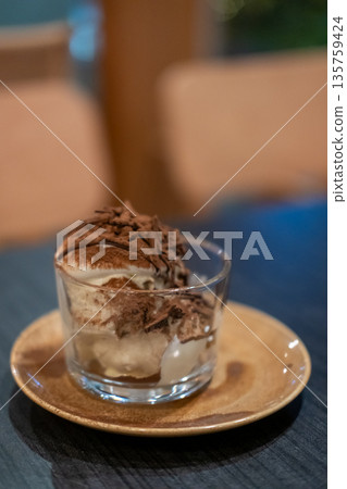 Square Tiramisu served in a cup in the cafe 135759424