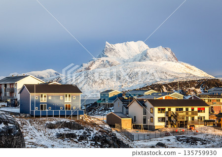 Residential architecture in arctic environment with snow covered Sermitsiaq mountain and clear winter light, highlighting northern urban landscape, Nuuk, Greenland 135759930