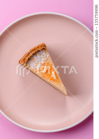 Cheesecake, a slice of sweet pie, a classic cheese dessert. Cheesecake as a food background 135759996