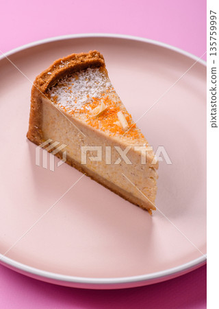 Cheesecake, a slice of sweet pie, a classic cheese dessert. Cheesecake as a food background 135759997