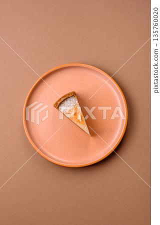 Cheesecake, a slice of sweet pie, a classic cheese dessert. Cheesecake as a food background Cheesecake, a slice of sweet pie, a classic cheese dessert. Cheesecake as a food background 135760020