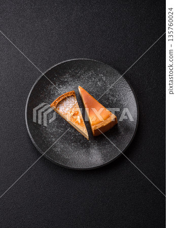 Cheesecake, a slice of sweet pie, a classic cheese dessert. Cheesecake as a food background Cheesecake, a slice of sweet pie, a classic cheese dessert. Cheesecake as a food background 135760024