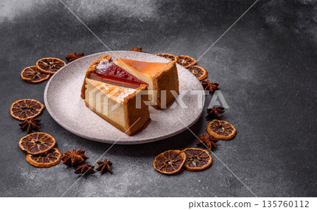 Cheesecake, a slice of sweet pie, a classic cheese dessert. Cheesecake as a food background Cheesecake, a slice of sweet pie, a classic cheese dessert. Cheesecake as a food background 135760112