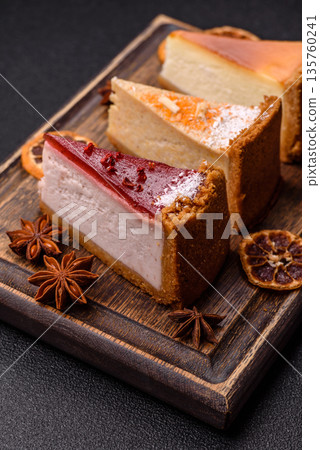 Cheesecake, a slice of sweet pie, a classic cheese dessert. Cheesecake as a food background Cheesecake, a slice of sweet pie, a classic cheese dessert. Cheesecake as a food background 135760241