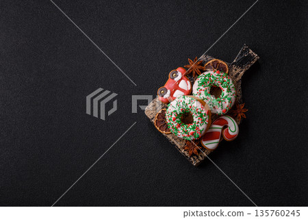 Christmas donuts or doughnuts, holiday winter sweets with sprinkles. Christmas donuts 135760245