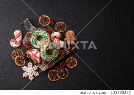 Christmas donuts or doughnuts, holiday winter sweets with sprinkles. Christmas donuts Christmas donuts or doughnuts, holiday winter sweets with sprinkles. Christmas donuts 135760257