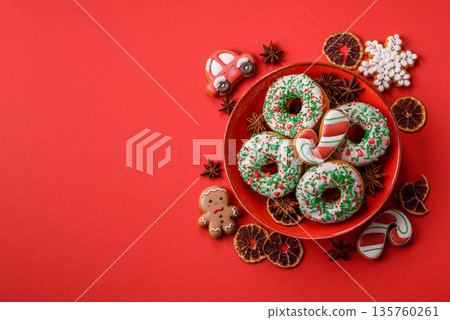 Christmas donuts or doughnuts, holiday winter sweets with sprinkles. Christmas donuts Christmas donuts or doughnuts, holiday winter sweets with sprinkles. Christmas donuts 135760261