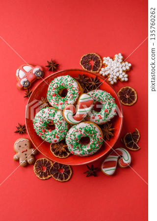 Christmas donuts or doughnuts, holiday winter sweets with sprinkles. Christmas donuts 135760262