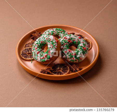 Christmas donuts or doughnuts, holiday winter sweets with sprinkles. Christmas donuts Christmas donuts or doughnuts, holiday winter sweets with sprinkles. Christmas donuts 135760279