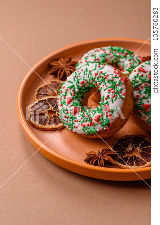 Christmas donuts or doughnuts, holiday winter sweets with sprinkles. Christmas donuts 135760283