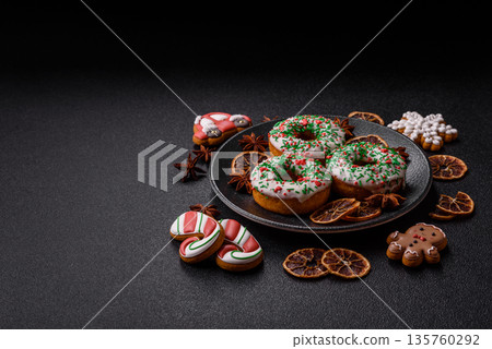 Christmas donuts or doughnuts, holiday winter sweets with sprinkles. Christmas donuts Christmas donuts or doughnuts, holiday winter sweets with sprinkles. Christmas donuts 135760292