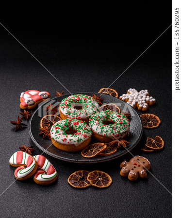 Christmas donuts or doughnuts, holiday winter sweets with sprinkles. Christmas donuts Christmas donuts or doughnuts, holiday winter sweets with sprinkles. Christmas donuts 135760295