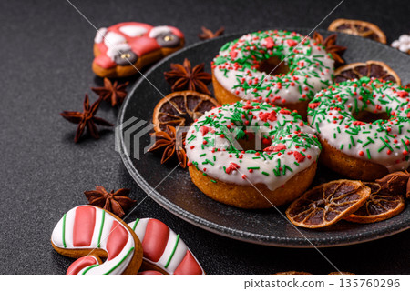 Christmas donuts or doughnuts, holiday winter sweets with sprinkles. Christmas donuts 135760296