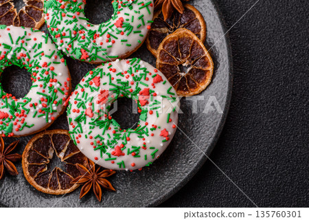 Christmas donuts or doughnuts, holiday winter sweets with sprinkles. Christmas donuts Christmas donuts or doughnuts, holiday winter sweets with sprinkles. Christmas donuts 135760301