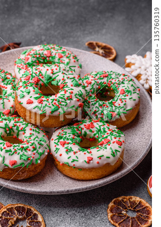 Christmas donuts or doughnuts, holiday winter sweets with sprinkles. Christmas donuts 135760319