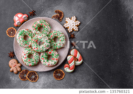 Christmas donuts or doughnuts, holiday winter sweets with sprinkles. Christmas donuts Christmas donuts or doughnuts, holiday winter sweets with sprinkles. Christmas donuts 135760321